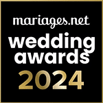 Badge noir et or mariages.net Wedding Awards 2024. Une récompense de l'excellence décernée par les professionnels du mariage.